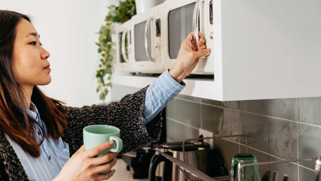 Reheat you coffee in microwave before drinking after you have left it out for a while.