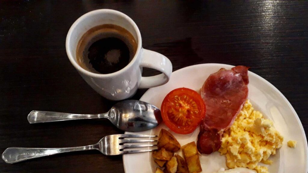 Start morning with scrambled eggs and eat along side coffee.