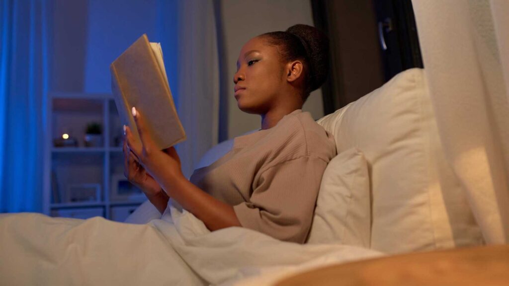 Reading a book is solution on how to go to sleep after drinking coffee.